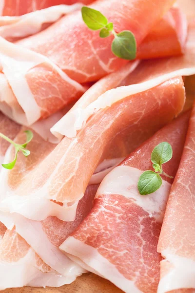 Sliced prosciutto ham closeup — Stock Photo, Image