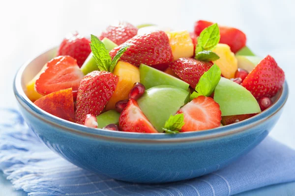 fresh fruit salad with strawberry, apple, nectarine, pomegranate