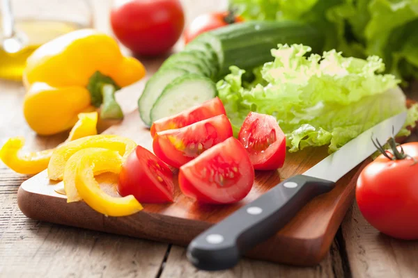 Fresh vegetables cucumber tomatoes pepper and salad leaves — Stock Photo, Image