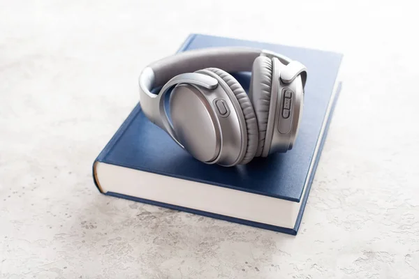 Audiobook Concept Modern Wireless Headphones Book — Stock Photo, Image