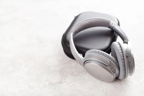 Modern Silver Wireless Headphones Concrete Background — Stock Photo, Image