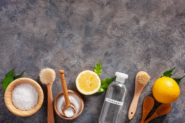 zero waste eco friendly cleaning concept. wooden brushes, lemon, baking soda, vinegar