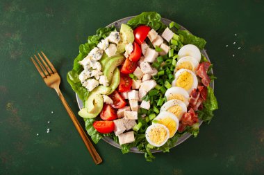 healthy American Cobb salad with egg bacon avocado chicken tomato. hearty keto low carb diet clipart