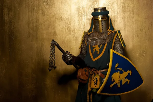 Medieval knight on golden background — Stock Photo, Image