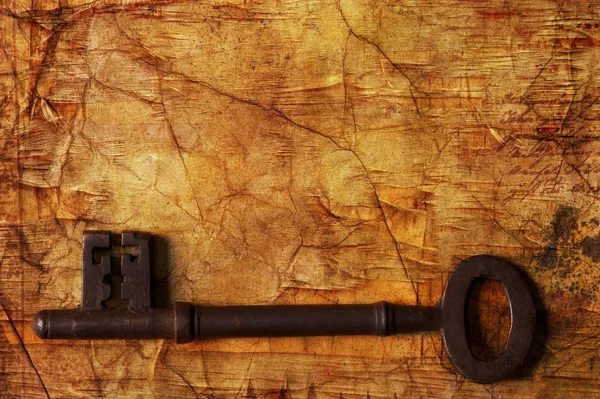 Old key on wooden background — Stock Photo, Image