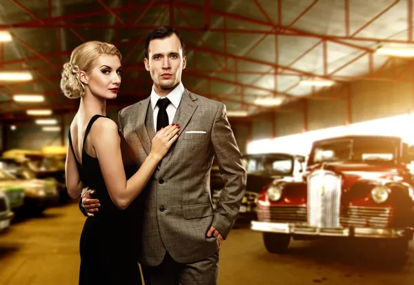 Couple in retro garage — Stock Photo, Image