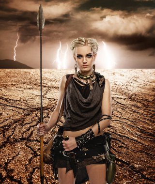 Woman with a spear in a desert clipart
