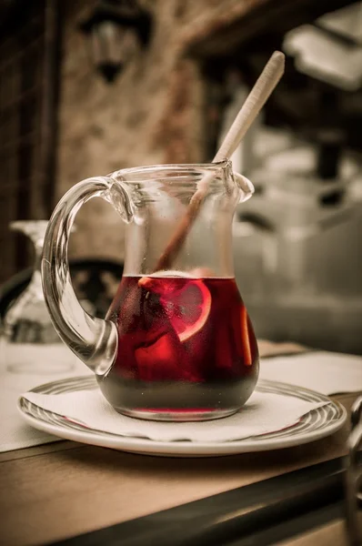 Sangria pitcher on a plate — Stock Photo, Image