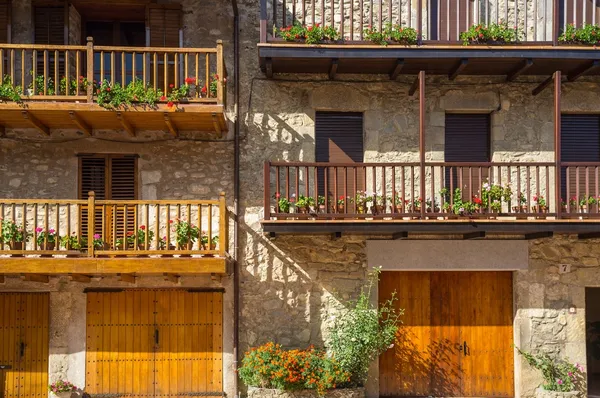 :Building facade with lot of flower pots — Stock Photo, Image