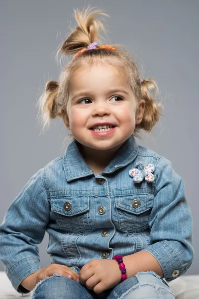 Funny little girl isolated on grey — Stock Photo, Image