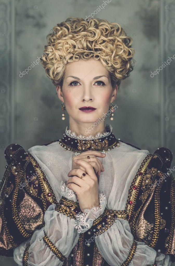 Picture of beautiful haughty queen in royal dress stock photo