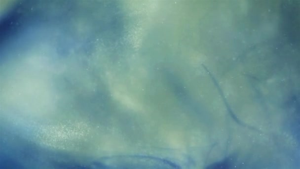Abstrakter Hintergrund von Farbtropfen, die ins Wasser fallen — Stockvideo