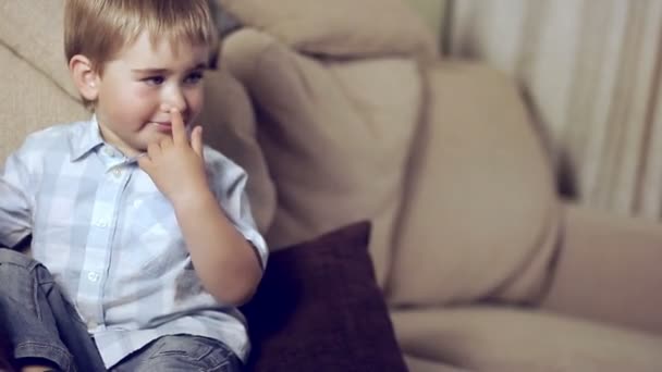 Baby boy on a sofa — Stock Video