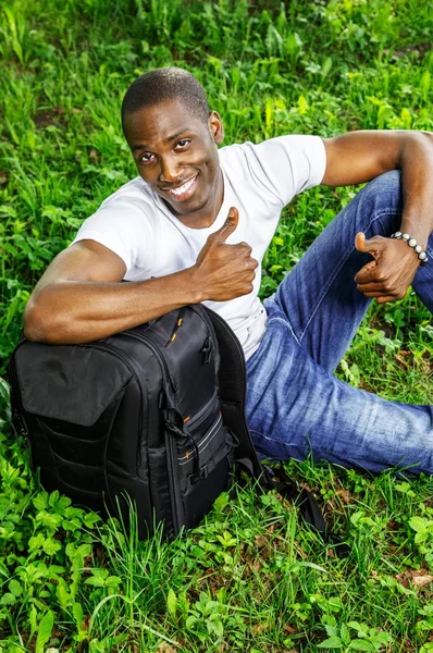 Young black guy in park — Stock Photo, Image