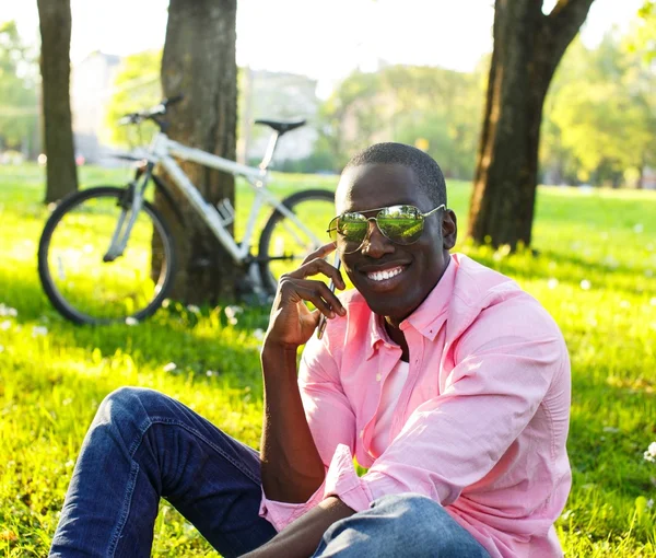 Young black guy in park — Stock Photo, Image