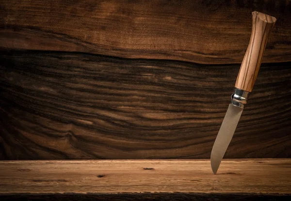Sharp knife on wooden background — Stock Photo, Image