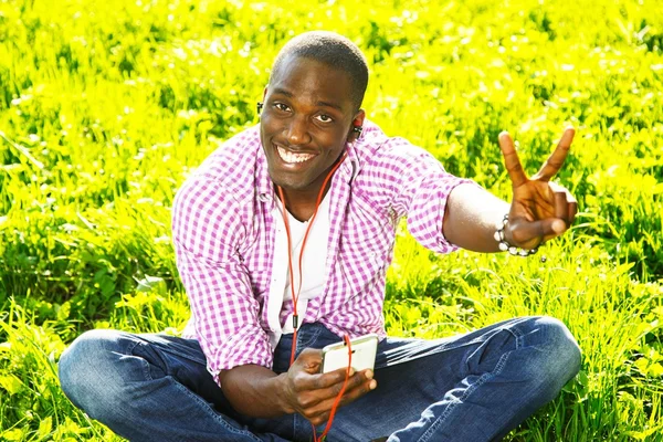 Young black guy in park — Stock Photo, Image