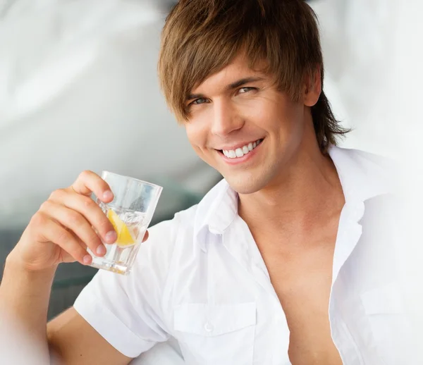 Young man with glass — Stock Photo, Image