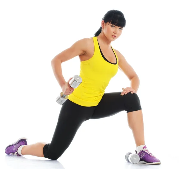 Menina fazendo exercício de fitness com halteres — Fotografia de Stock