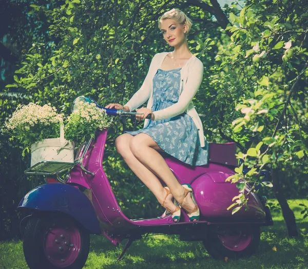 Woman sitting on a retro roller — Stock Photo, Image