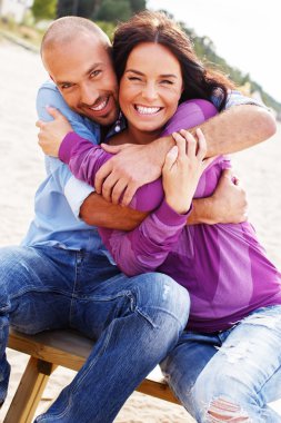 Middle-aged couple on a beach clipart