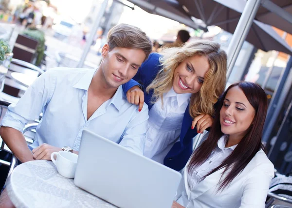 Young people with laptop — Stock Photo, Image