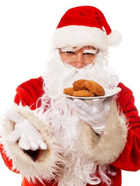 Papai Noel segurando prato com biscoitos de aveia — Fotografia de Stock