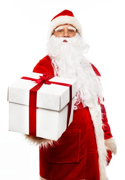 Santa Claus presenting gift box isolated on white background Royalty Free Stock Photos