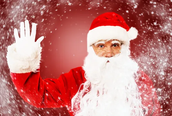 Santa claus visar med gester något — Stockfoto