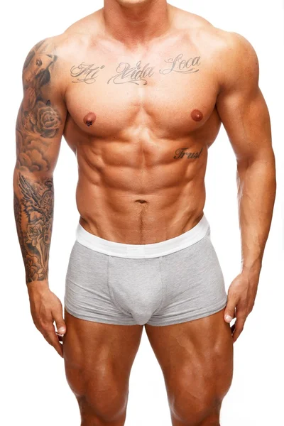 Homem com belo músculo tatuado tronco em roupa interior — Fotografia de Stock