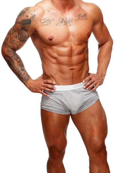 Człowiek z pięknym mięśni tułowia tatuażem w bieliźnie — Zdjęcie stockowe