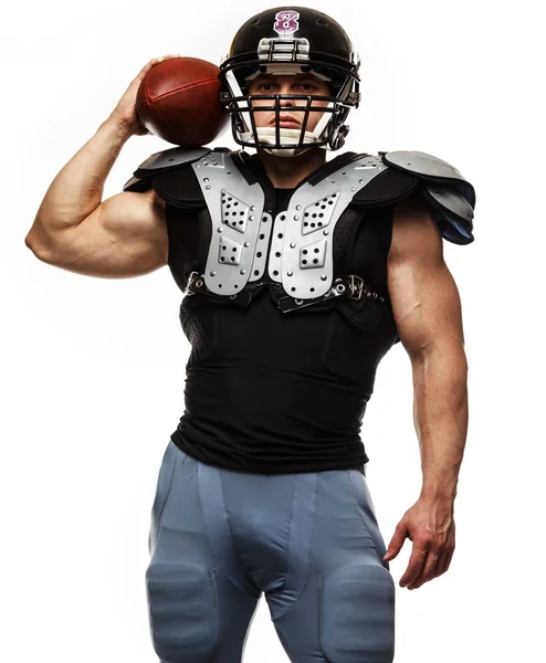 American football player with ball wearing helmet and protective shields — Stock Photo, Image