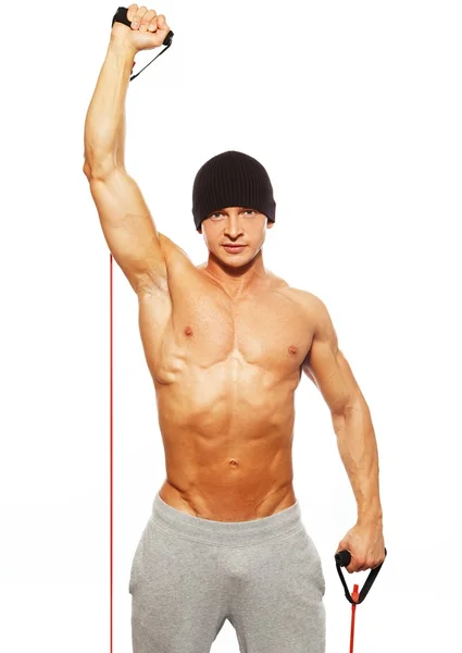 Hombre guapo con cuerpo muscular haciendo ejercicio físico — Foto de Stock