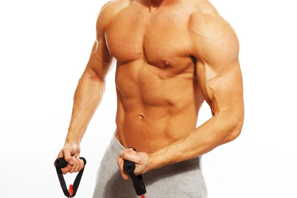 Handsome man with muscular body doing fitness exercise — Stock Photo, Image