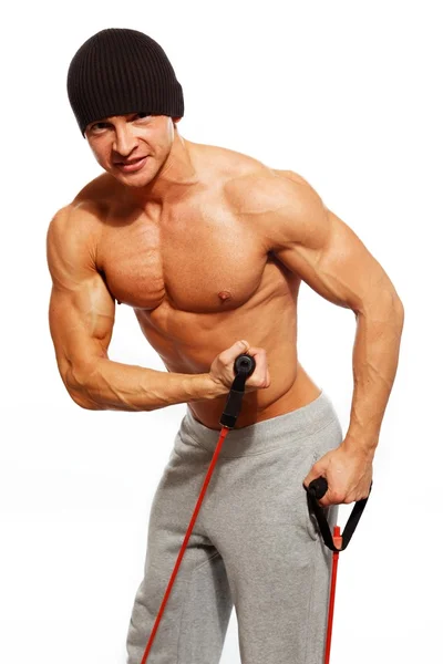 Stilig man med muskulös kropp gör fitness motion — Stockfoto