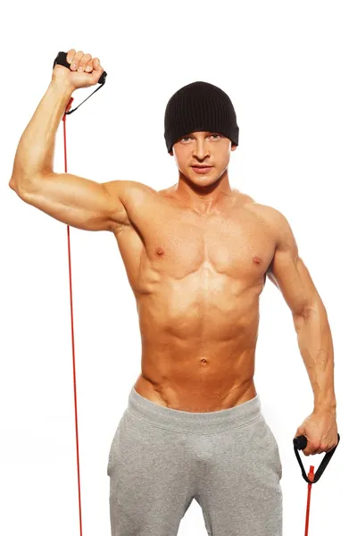 英俊的男人，与肌肉发达的身体做健身运动 — 图库照片