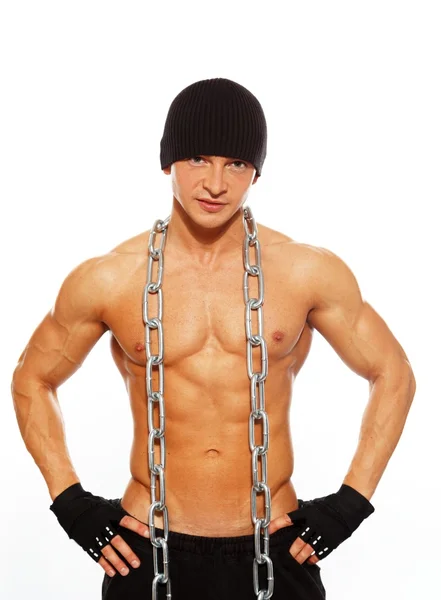 Handsome muscular man in beanie hat with chain — Stock Photo, Image