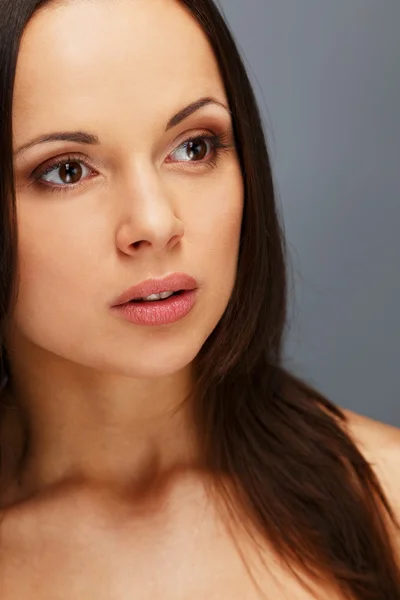 Beautiful young brunette woman with brown eyes and long hair — Stock Photo, Image