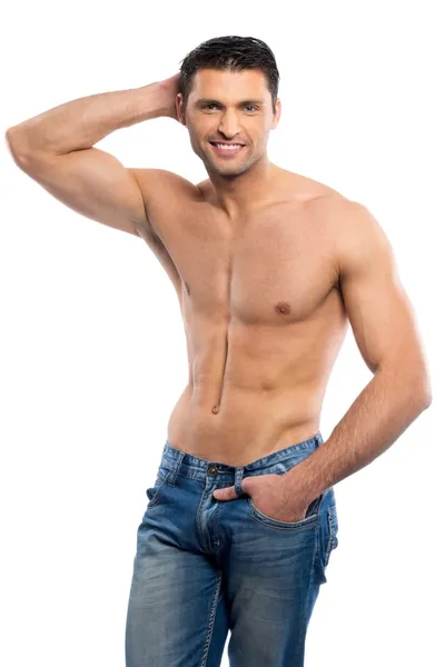 Bello giovanotto in blue jeans con busto nudo — Foto Stock