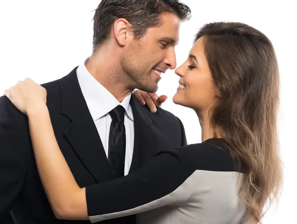 Belo jovem casal de terno e vestido isolado no fundo branco — Fotografia de Stock