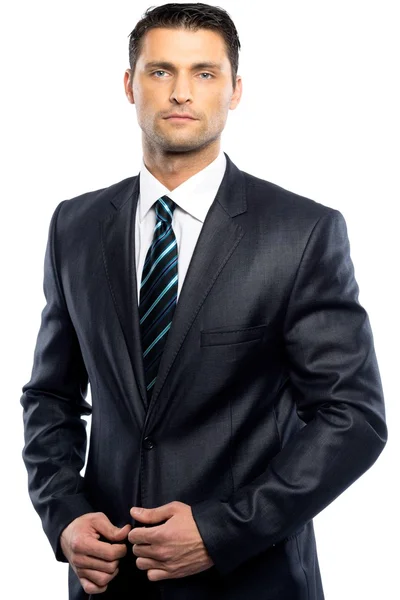 Przystojny młody mężczyzna w czarny garnitur i krawat na białym tle — Zdjęcie stockowe