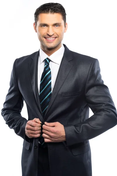 Красивий молодий чоловік в чорному костюмі і краватка ізольовані на білому тлі — стокове фото