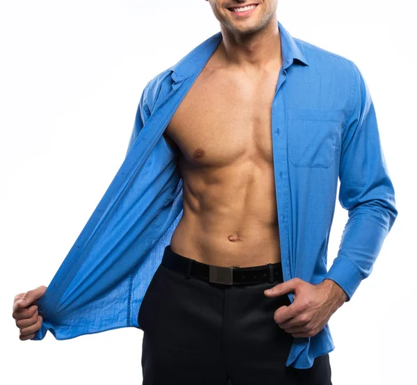 Schöner sexy Mann in blauem Hemd und schwarzer Hose — Stockfoto