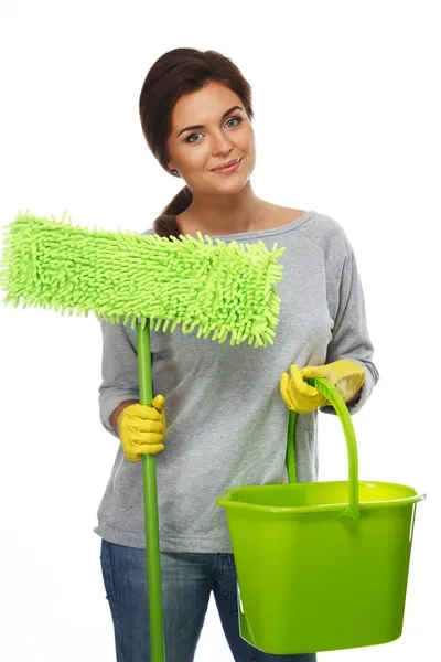 Beautiful cheerful brunette woman in gloves with mop and bucket — Stock Photo, Image