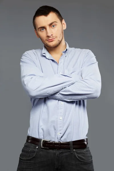 Handsome young man in a blue shirt — Stock Photo, Image