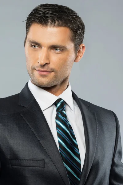 Well-dressed handsome man in black suit and tie — Stock Photo, Image