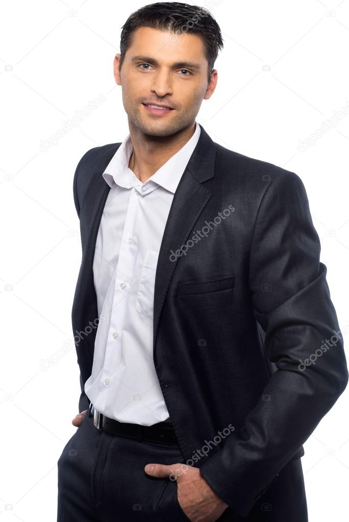 Красивый молодой человек в черном костюме и белой рубашке на белом фонестоковое фото ©nejron 38757375