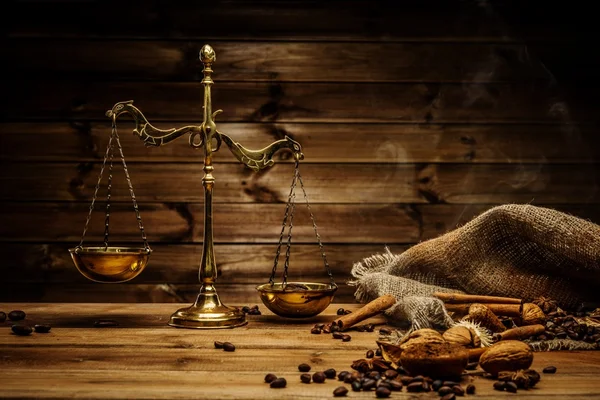 Coffee theme with brass scales still-life on wooden table — Stock Photo, Image