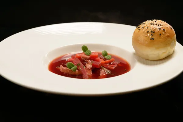 Red borscht with pieces of meat — Stock Photo, Image