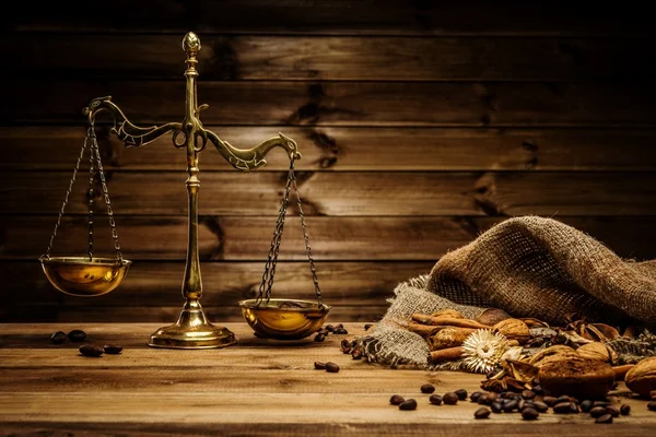 Coffee theme with brass scales still-life on wooden table — Stock Photo, Image